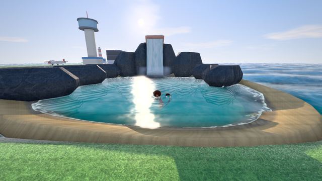 Swimming in the lagoon under the waterfall